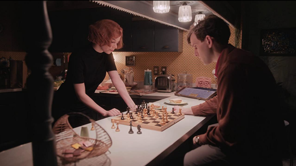 Anya Taylor-Joy as Beth Harmon and Harry Melling as Harry Beltik in The Queen's Gambit 