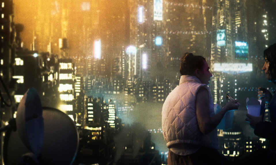 A man and a woman stand speaking to each other in the foreground with a hazy futuristic cityscape in the background.
