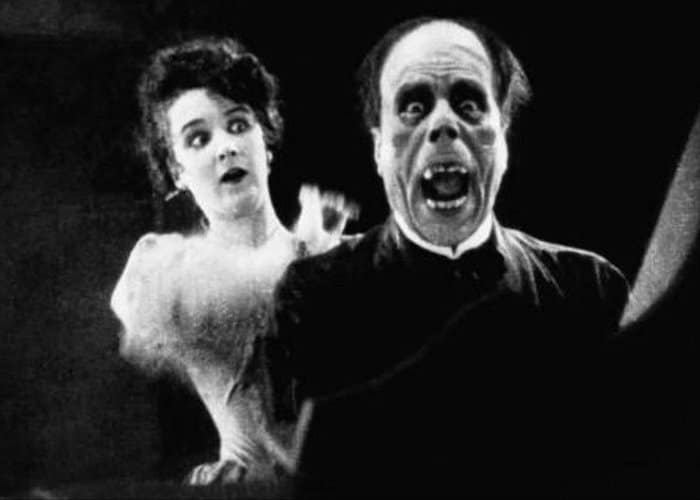 One of the earliest horror jump scares in The Phantom of the Opera (1925) // Credit: Universal