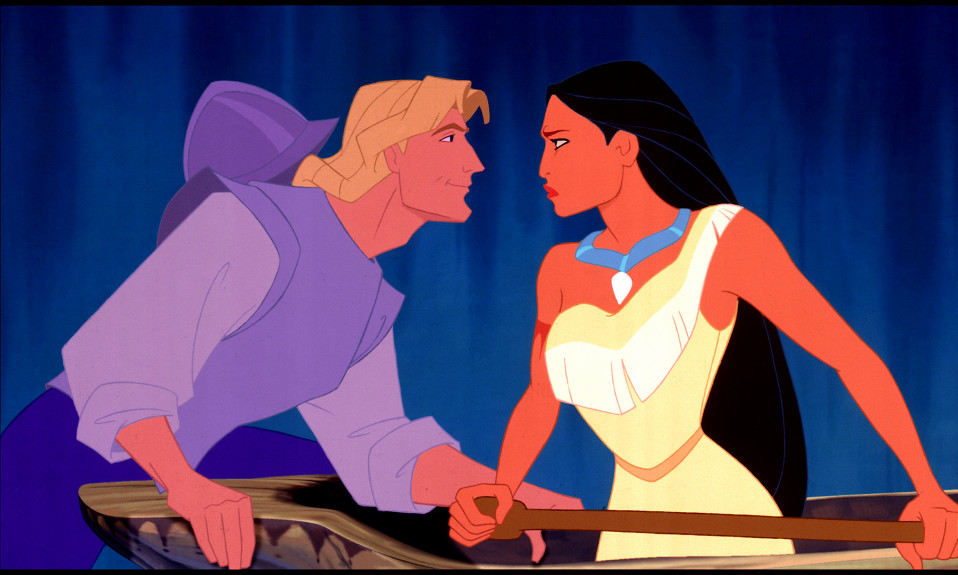 Animated characters of Pocahontas, a brown-skinned Native American woman with long black hair and wearing a traditional dress, and John Smith, a muscular blonde white Englishman in soldier's gear, looking at each other during a confrontation. John, on the left, has a small smile on his face while Pocahontas, on the right, is scowling.